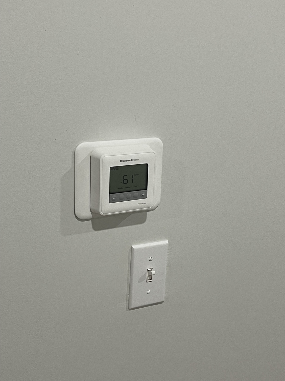 Honeywell thermostat installed on wall